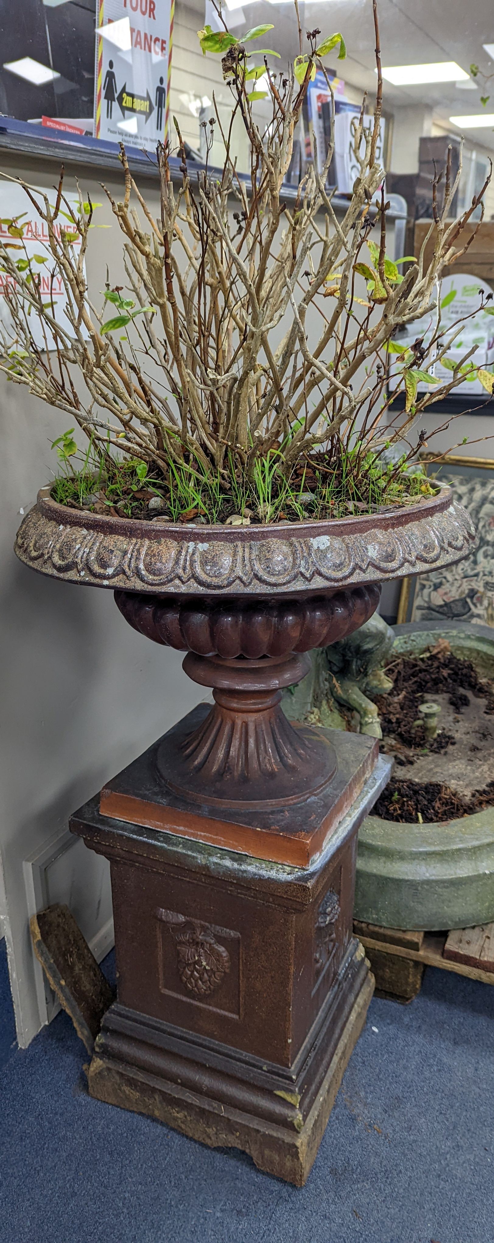 A Victorian glazed earthenware campana garden urn on square plinth, height 99cm